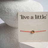 "live a little" Armband
